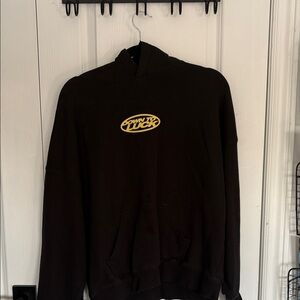 Black Hoodie with Yellow Graphic
Cold Culture